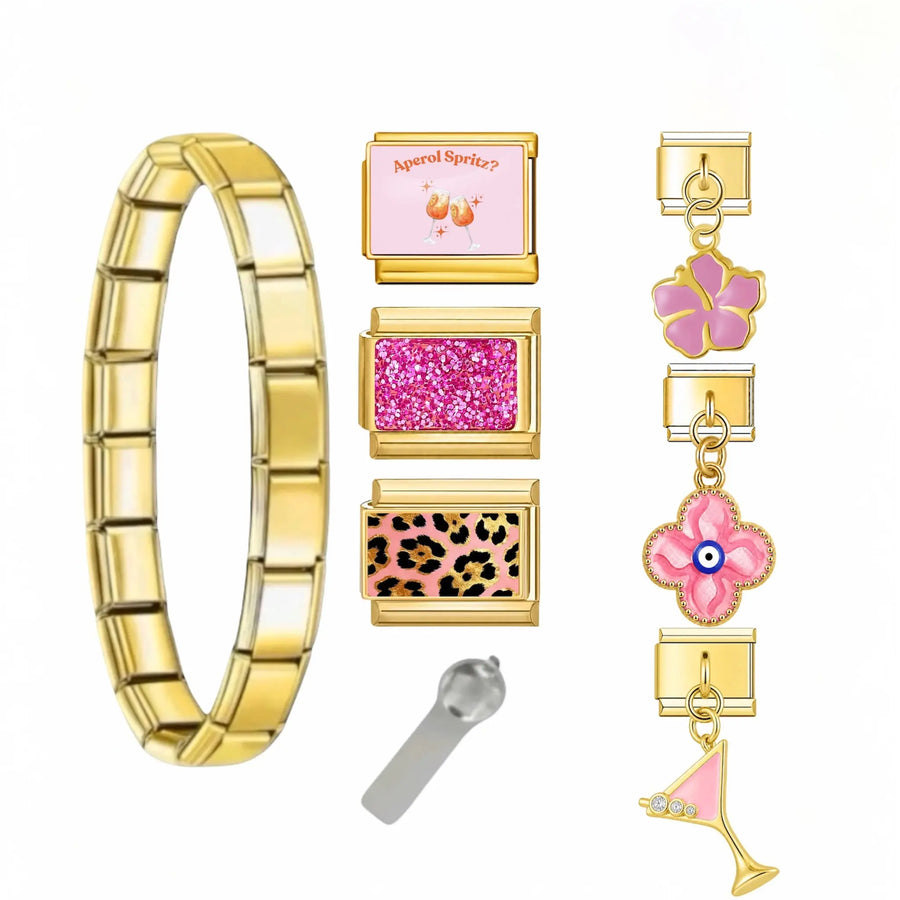 Bracelet charm cocktail soirée en acier inoxydable doré avec charms Aperol Spritz, pailleté rose fuchsia, léopard rose, hibiscus, trèfle œil protecteur et martini strass — bracelet charm italien